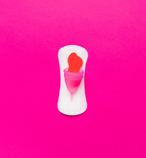 top-view-sanitary-towel-with-menstrual-cup_23-2148104188